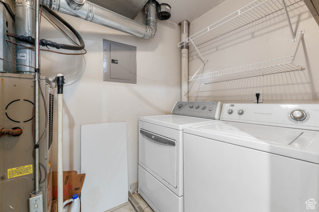 Washroom with electric panel and separate washer and dryer