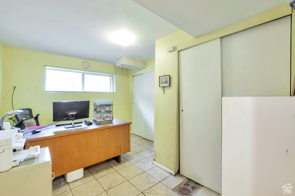 Office space with light tile patterned floors