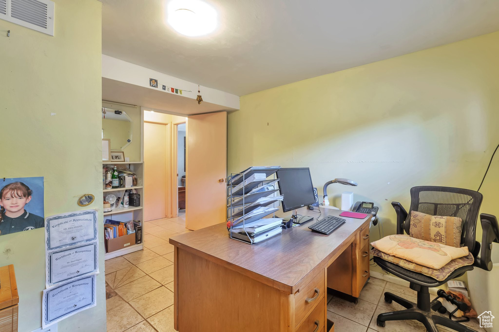 Office area with light tile patterned floors