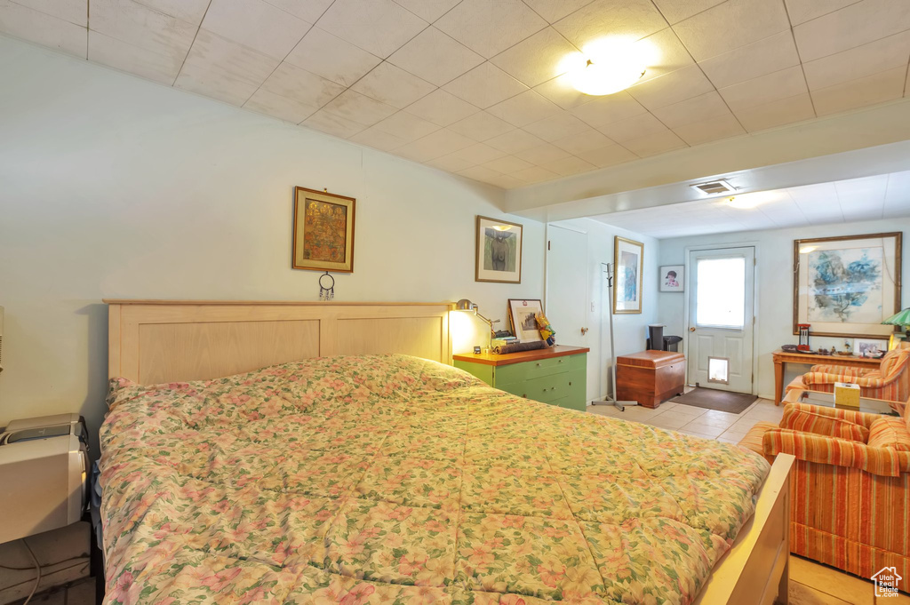 Bedroom featuring light tile patterned flooring