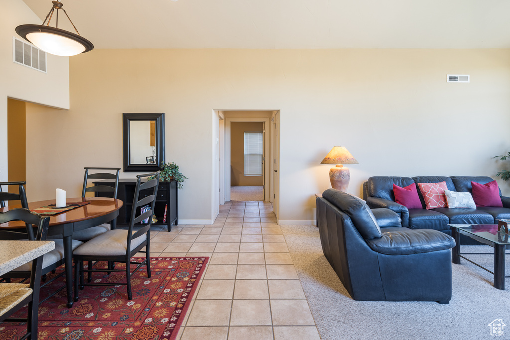 Living room with light tile patterned floors and baseboards