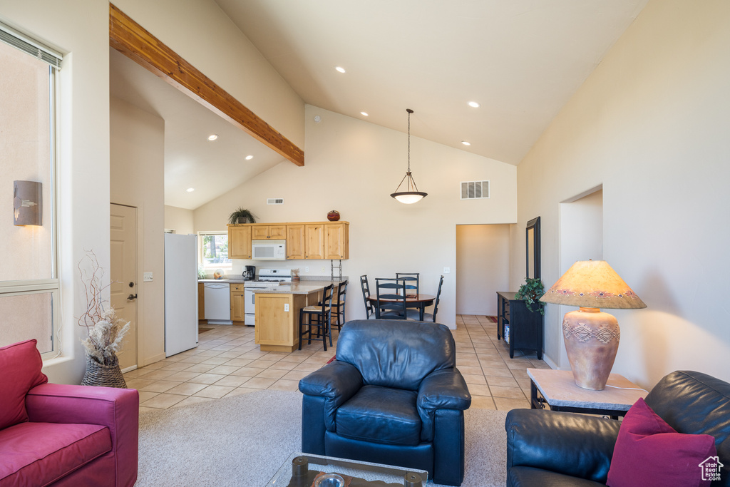 Living area with high vaulted ceiling, recessed lighting, light tile patterned floors, and beamed ceiling