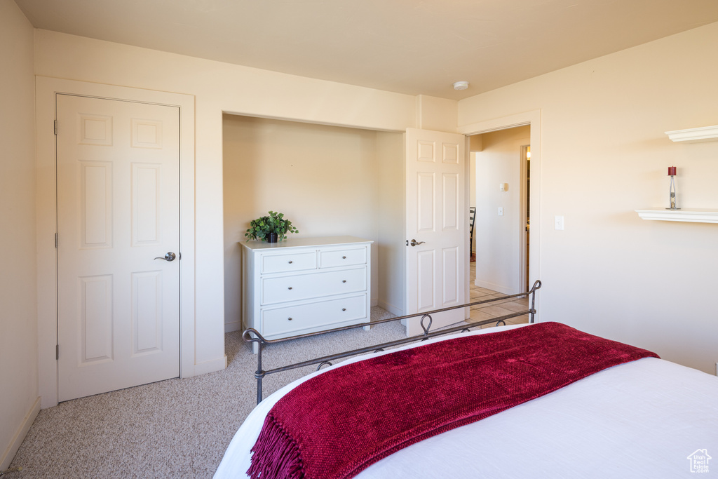 Bedroom with carpet and baseboards