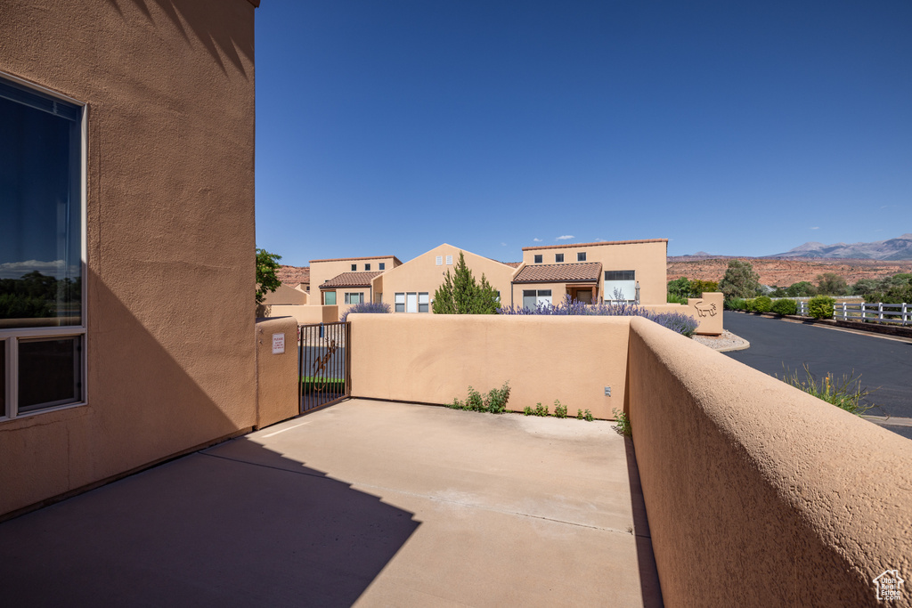 Patio / terrace with a mountain view and a gate