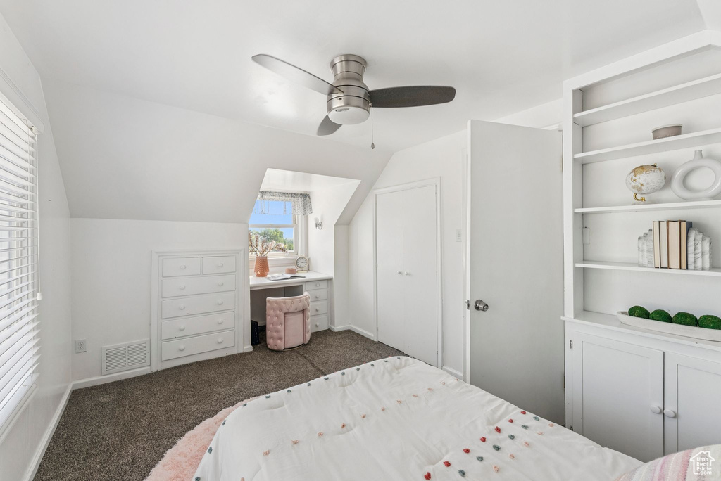 Bedroom featuring carpet, lofted ceiling, and ceiling fan