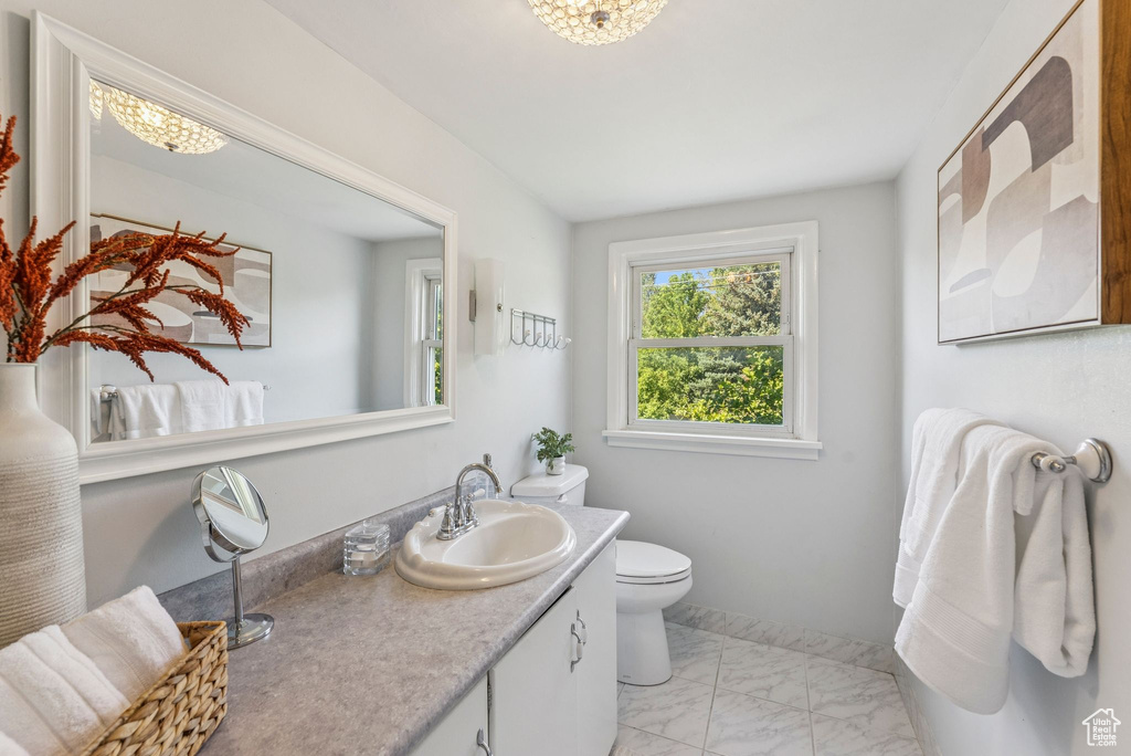 Bathroom featuring vanity and marble finish floors