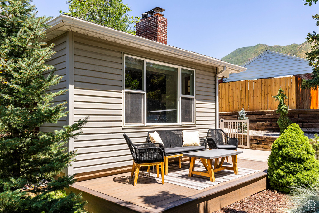 Wooden deck featuring a mountain view