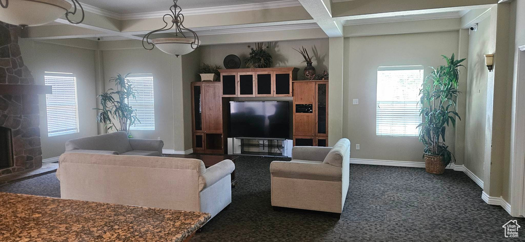 Carpeted living room featuring coffered ceiling, beamed ceiling, crown molding, and a fireplace