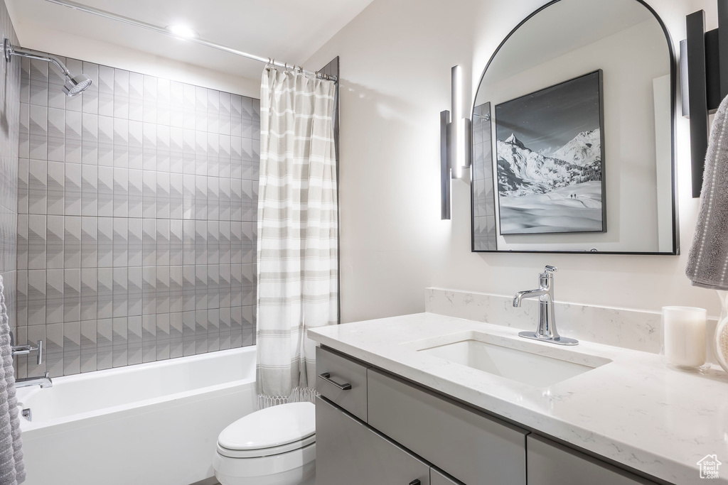Full bath featuring vanity and shower / tub combo
