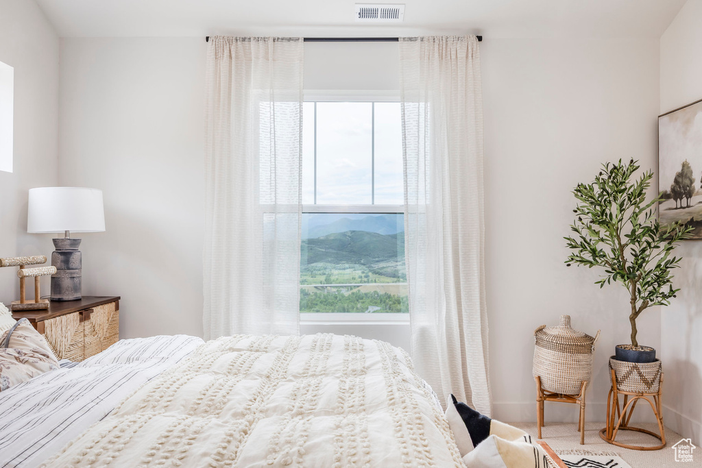 Bedroom featuring multiple windows