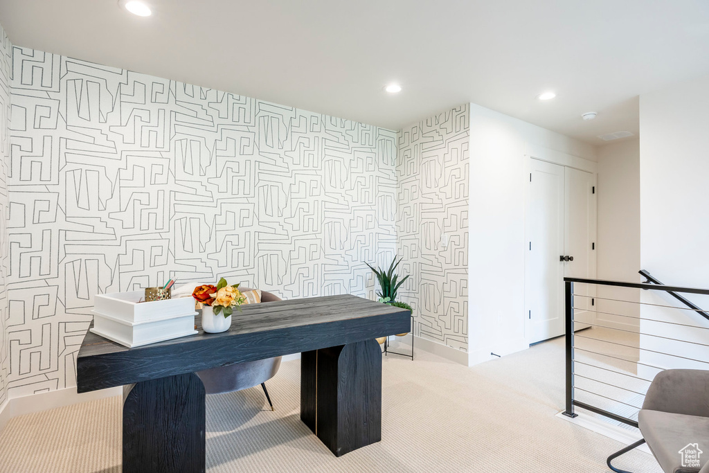 Home office featuring wallpapered walls, recessed lighting, and light carpet