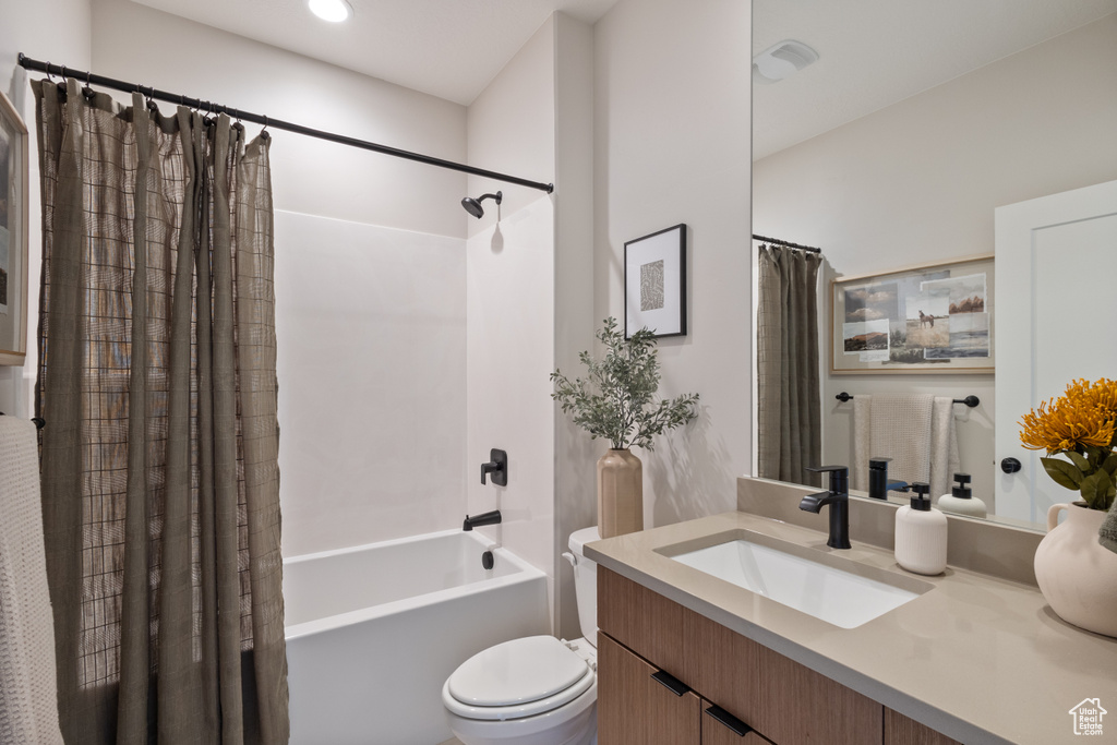 Full bathroom with vanity and shower / bath combination with curtain