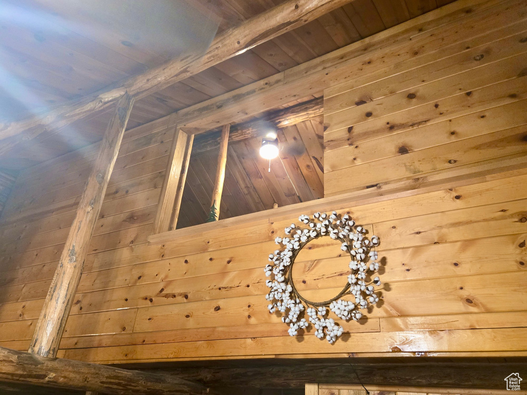 Detailed view of a wooden ceiling with exposed beams and wood walls