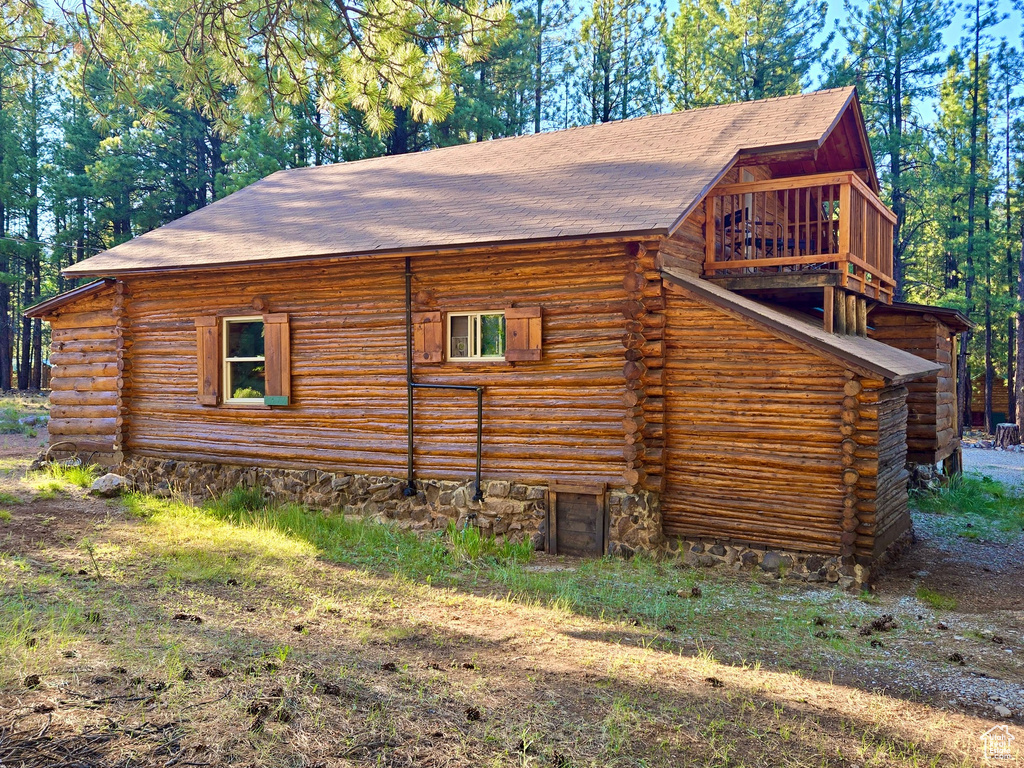 View of side of home with log siding