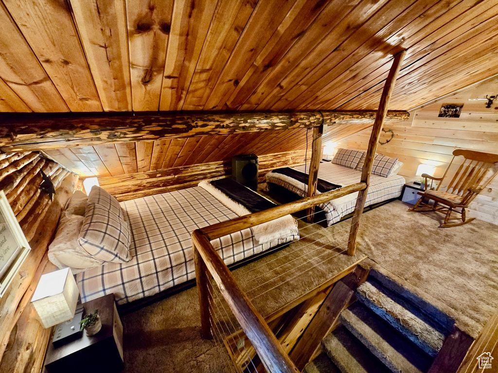 Bedroom featuring wooden ceiling, a sauna / steam room, carpet floors, and wood walls