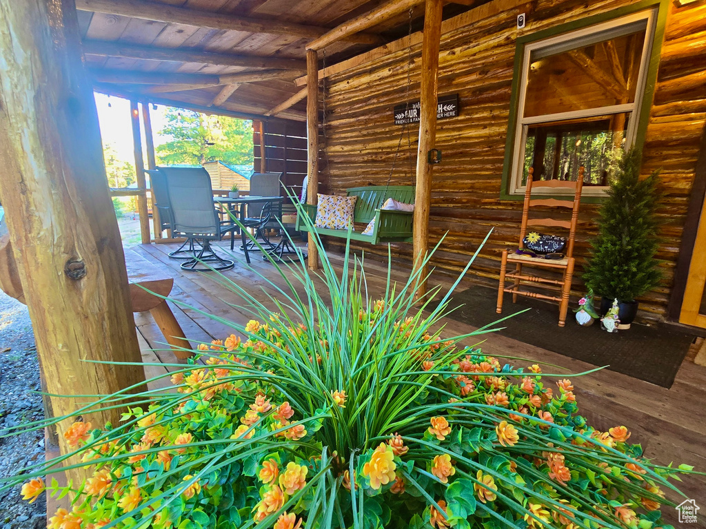Wooden deck featuring outdoor dining area
