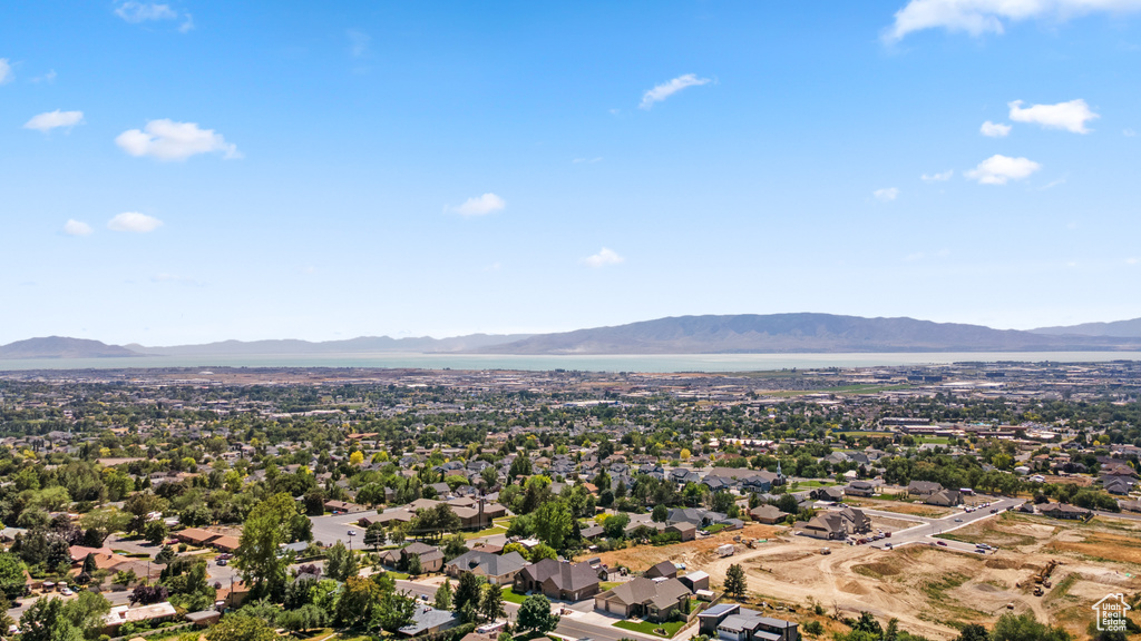 Aerial view of residential area featuring a mountainous background