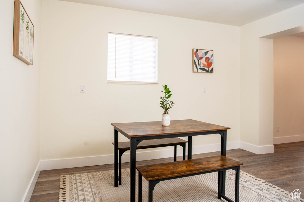Dining area with wood finished floors