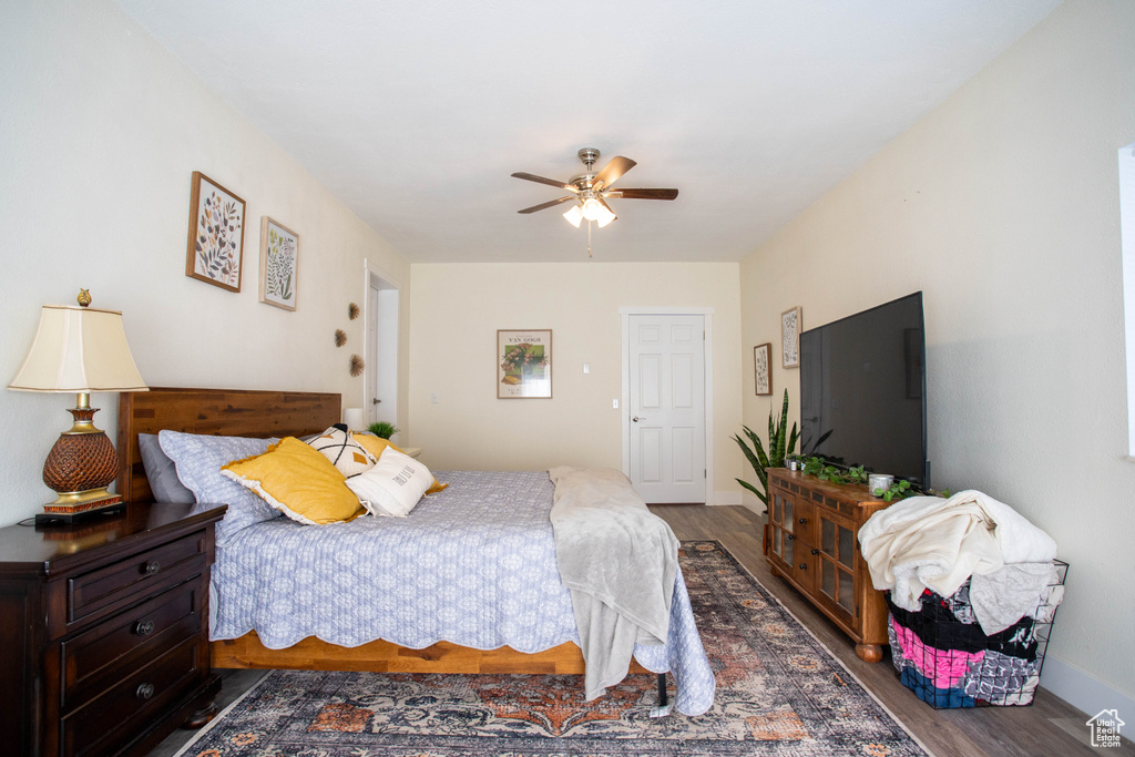 Bedroom with wood finished floors and ceiling fan
