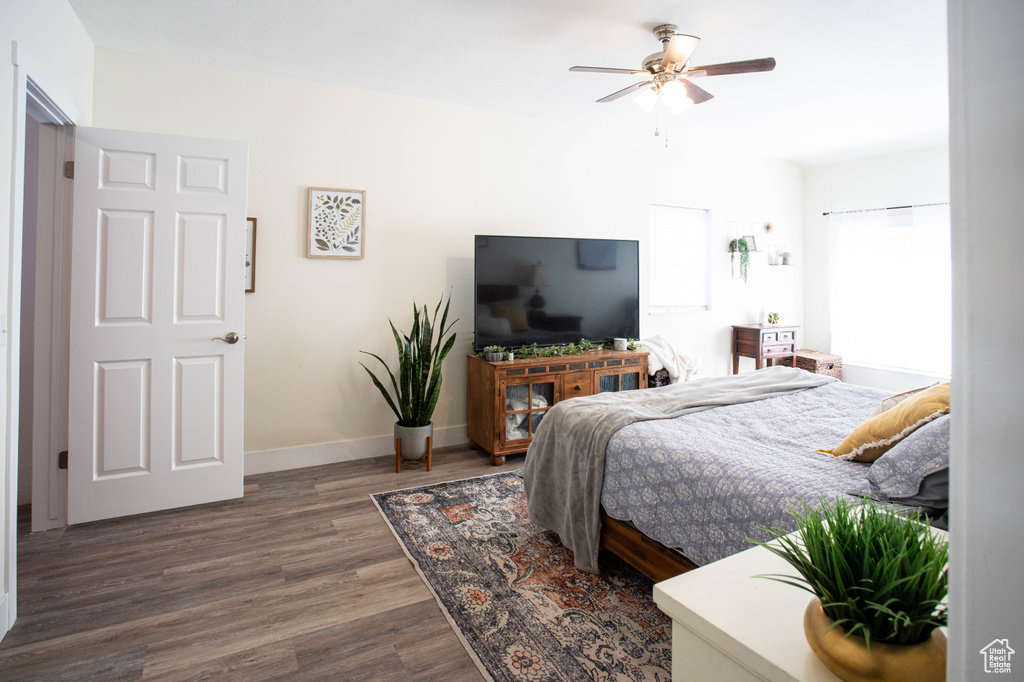 Bedroom featuring dark wood-style flooring and a ceiling fan