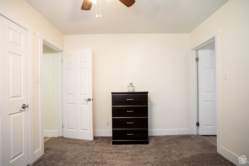 Unfurnished bedroom with carpet flooring and a ceiling fan