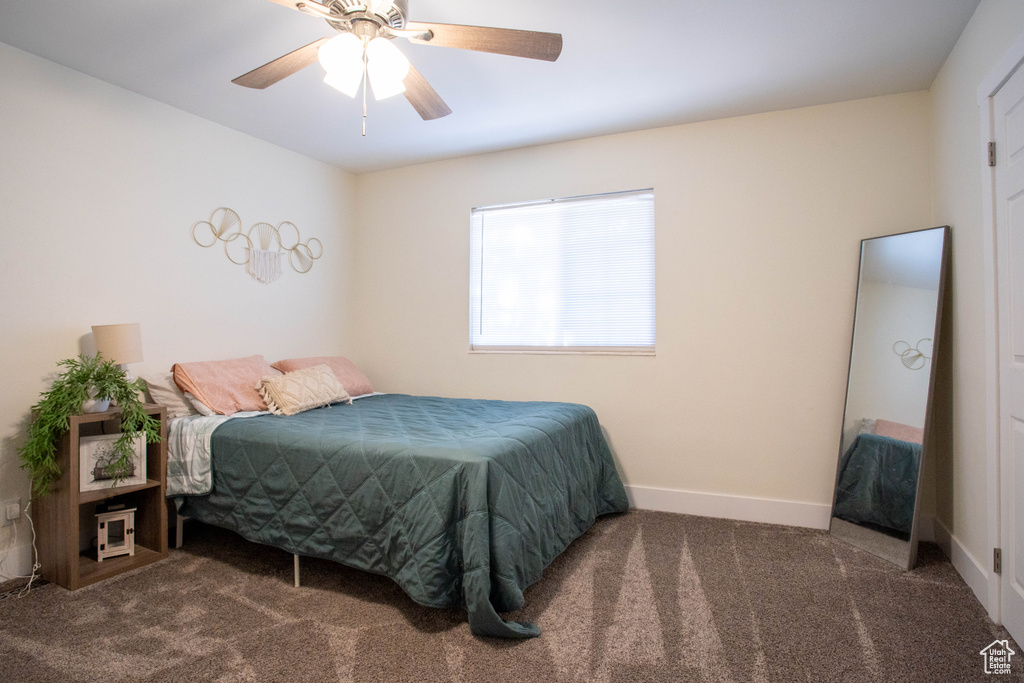 Bedroom featuring carpet and ceiling fan