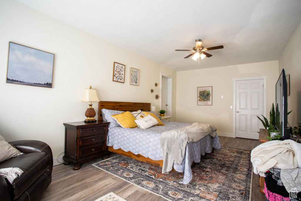 Bedroom featuring wood finished floors and ceiling fan