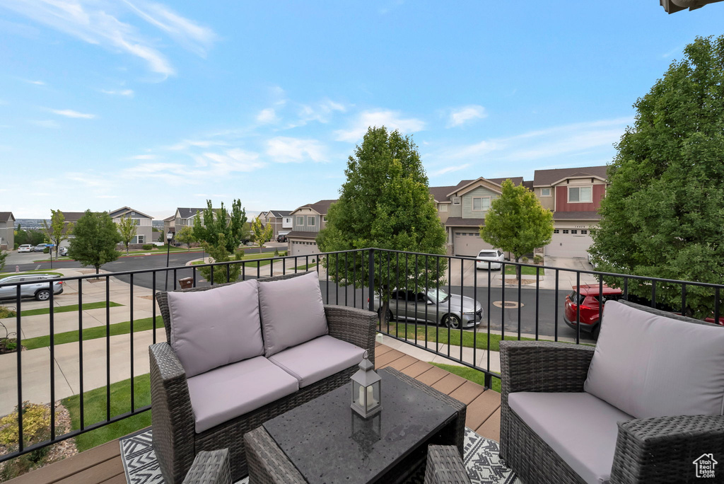 Deck with a residential view, outdoor lounge area, and a garage