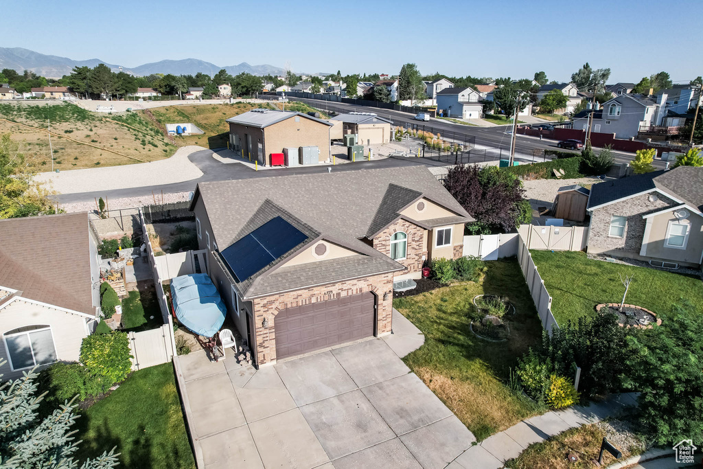 Aerial view of residential area featuring mountains