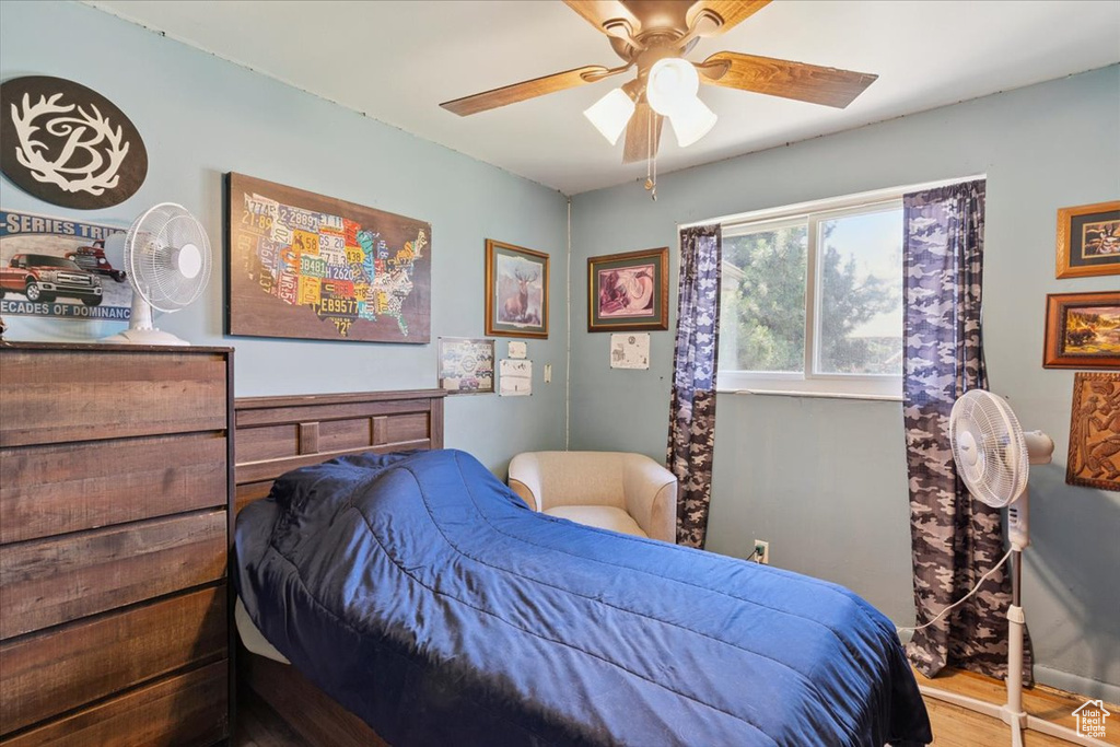 Bedroom featuring wood finished floors and ceiling fan