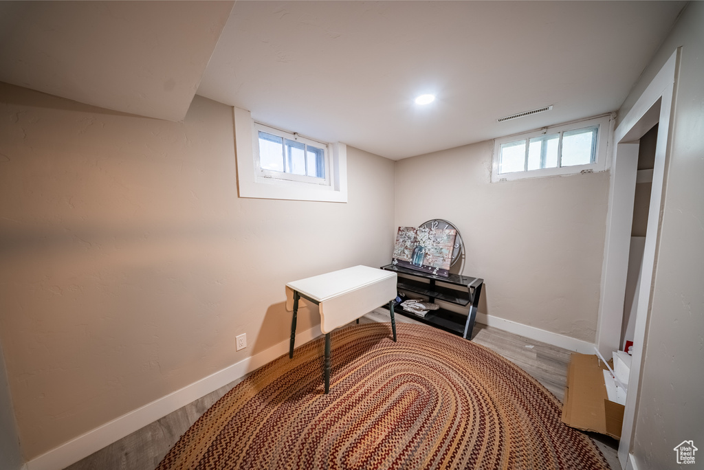 Below grade area with wood finished floors and baseboards