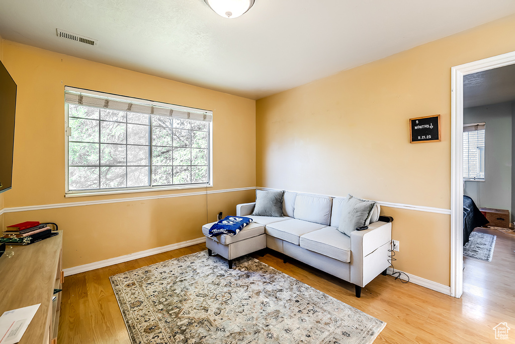 Living area featuring wood finished floors and baseboards