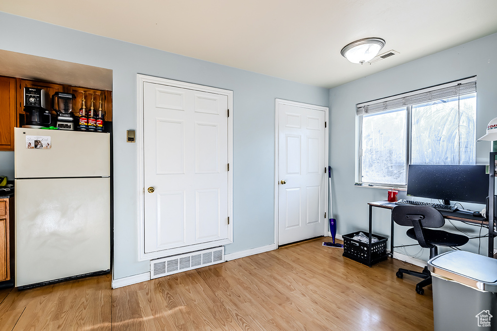 Home office featuring light wood-style flooring