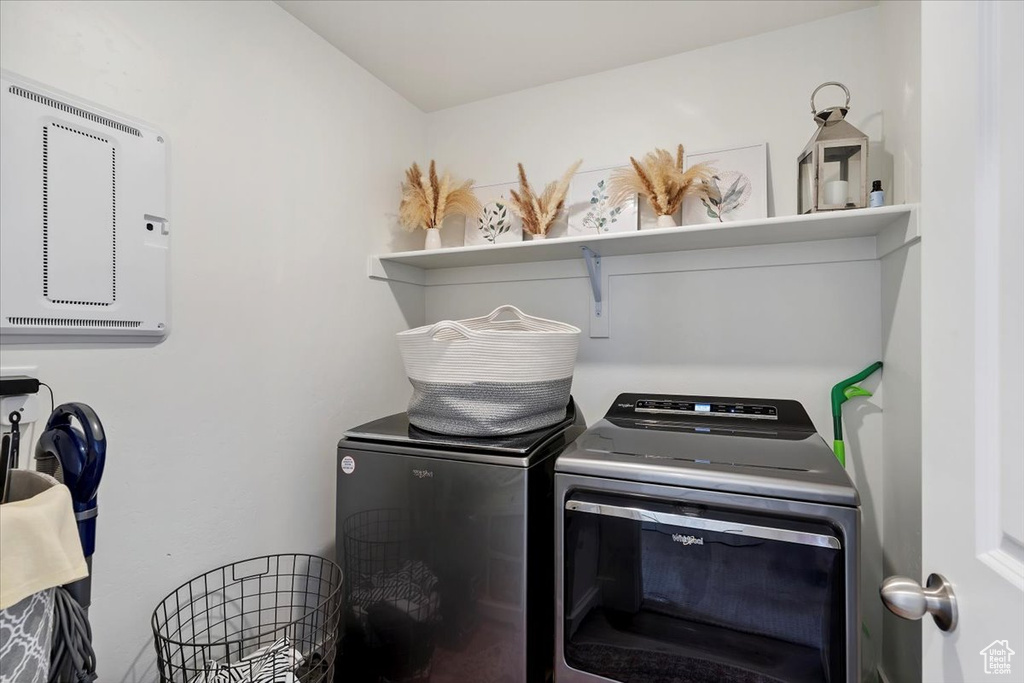 Laundry room with washing machine and clothes dryer