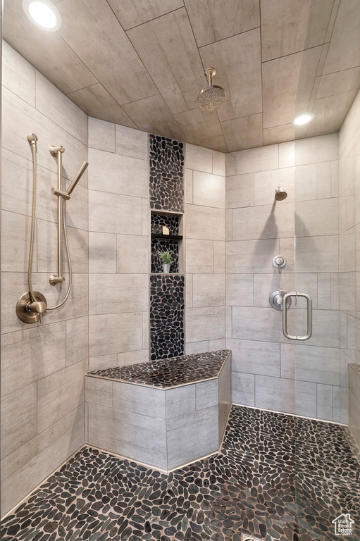 Bathroom with a tile shower and recessed lighting