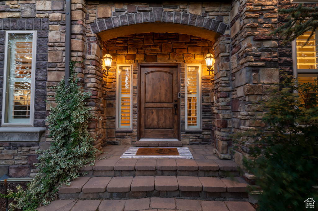 Property entrance with stone siding