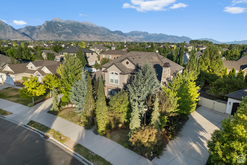 Aerial perspective of suburban area featuring a mountainous background