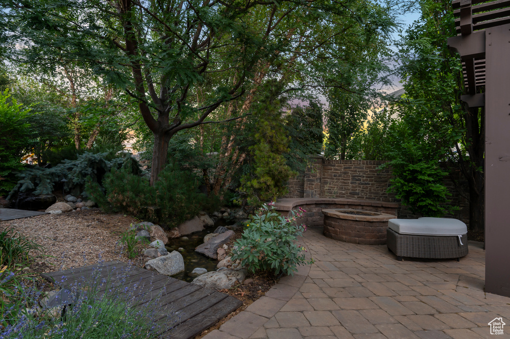 View of patio / terrace with a fire pit