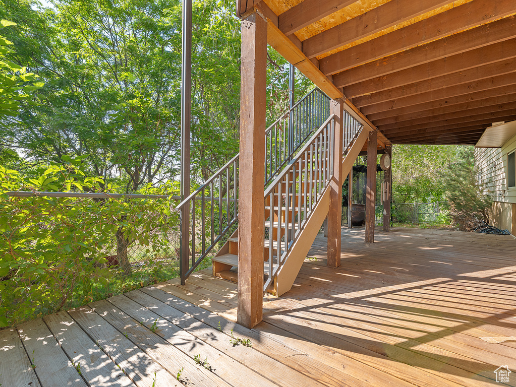 Wooden terrace featuring stairs