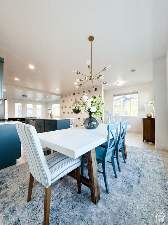 Dining space with a chandelier, recessed lighting, and healthy amount of natural light