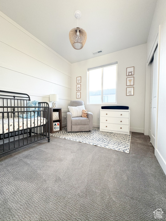 Bedroom with carpet flooring and baseboards