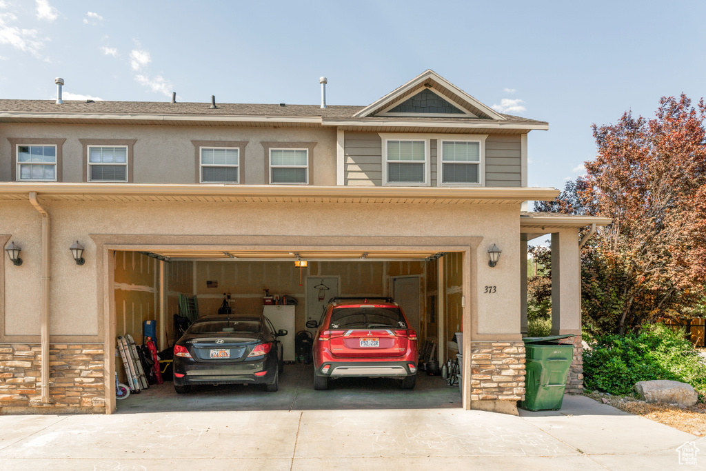Garage featuring driveway