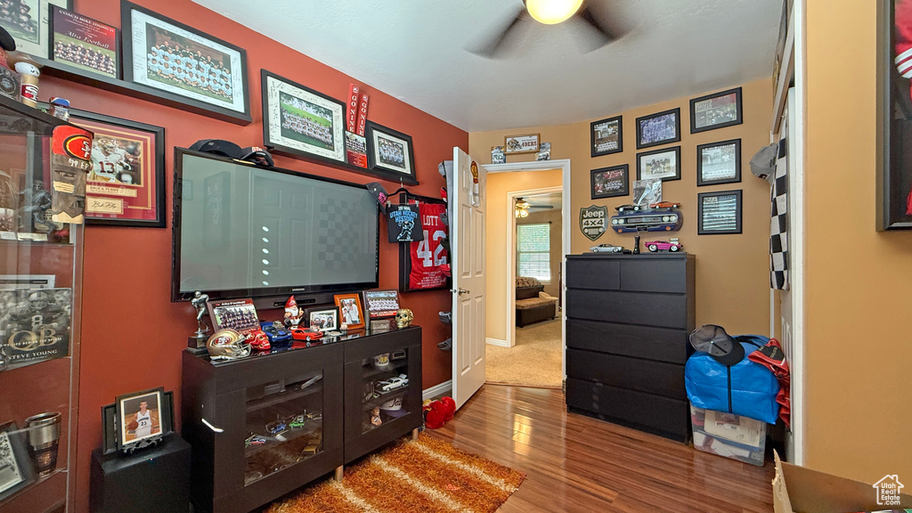 Home office featuring a ceiling fan and wood finished floors