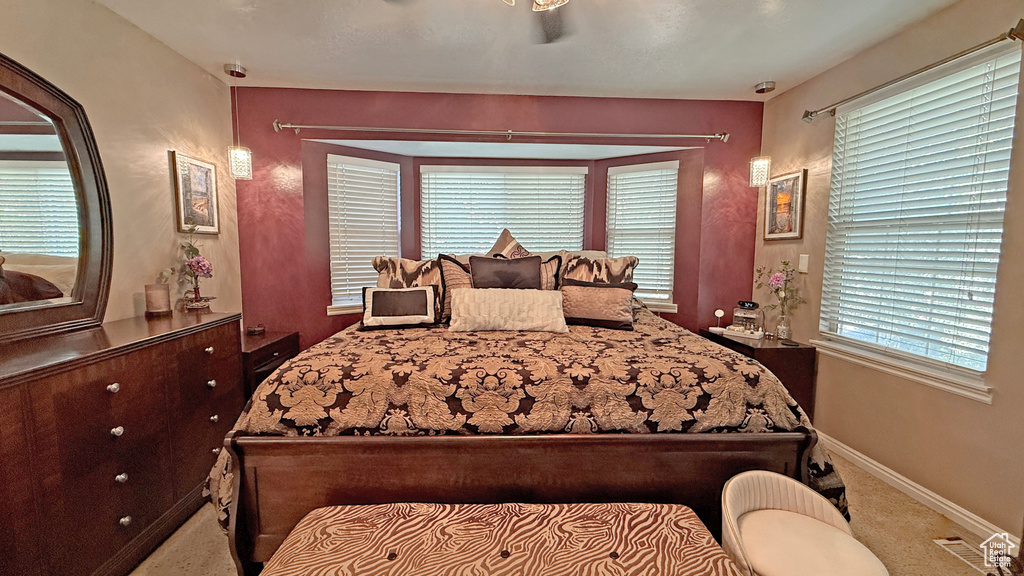Bedroom with baseboards and carpet