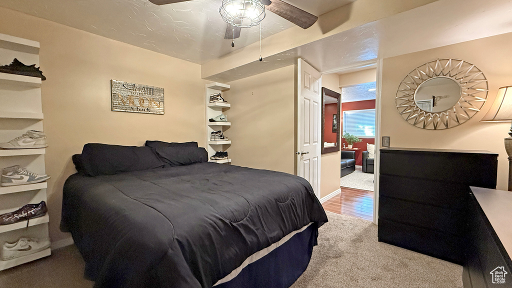 Bedroom with carpet flooring and a ceiling fan