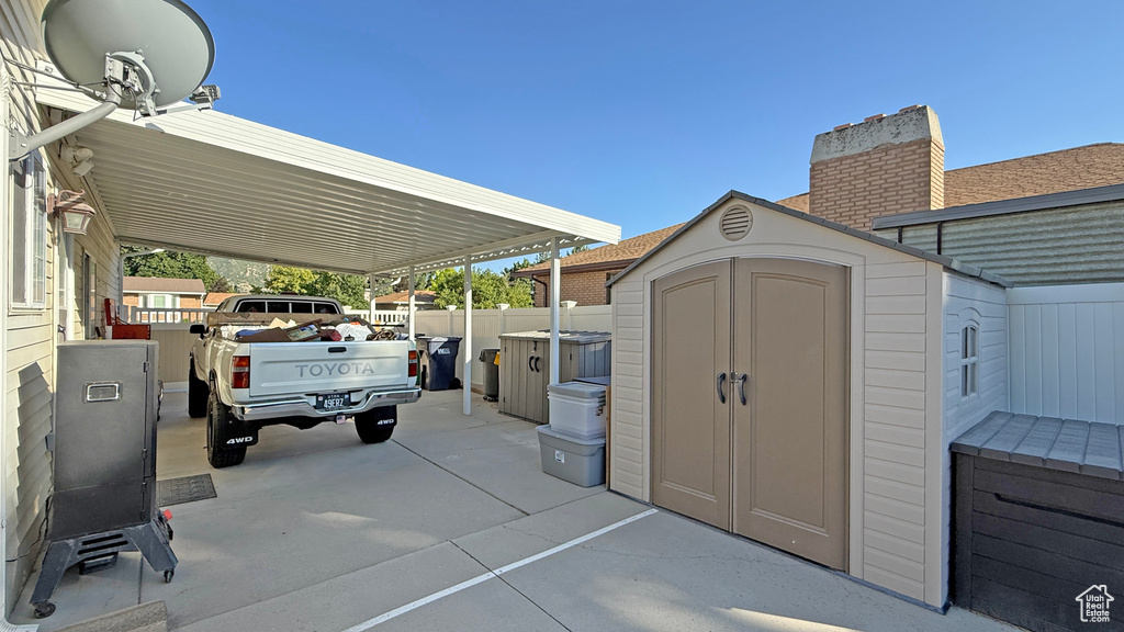 View of patio / terrace with a shed
