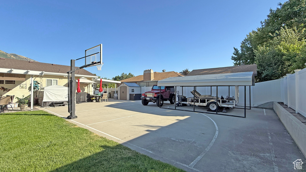 View of sport court featuring a storage unit