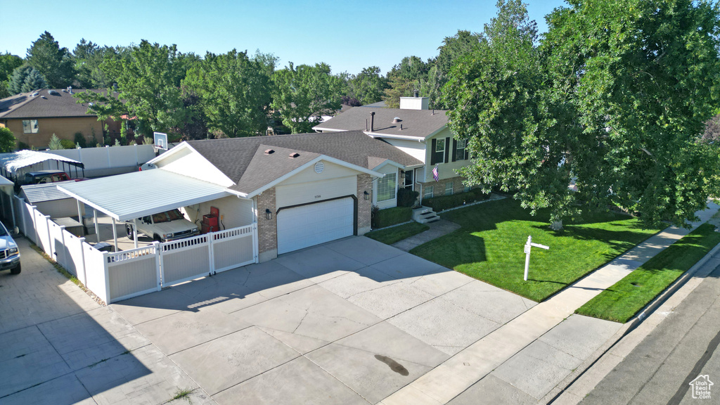 View of front of home featuring brick siding, driveway, an attached garage, and a shingled roof