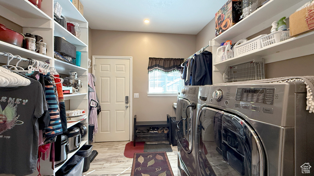 Laundry room featuring independent washer and dryer
