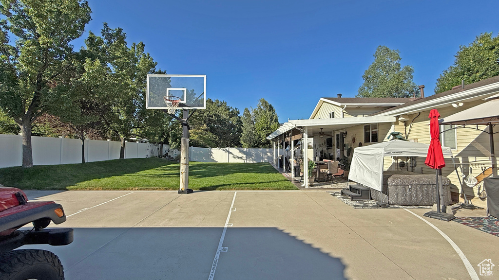 View of basketball court featuring a fenced backyard